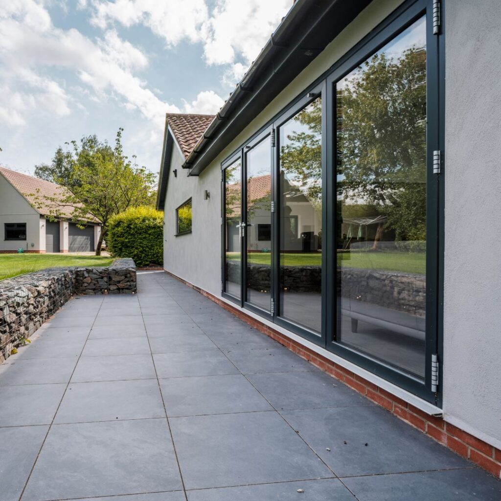 Black 4-Panel Aluminium Bifold Doors Installed in a Home